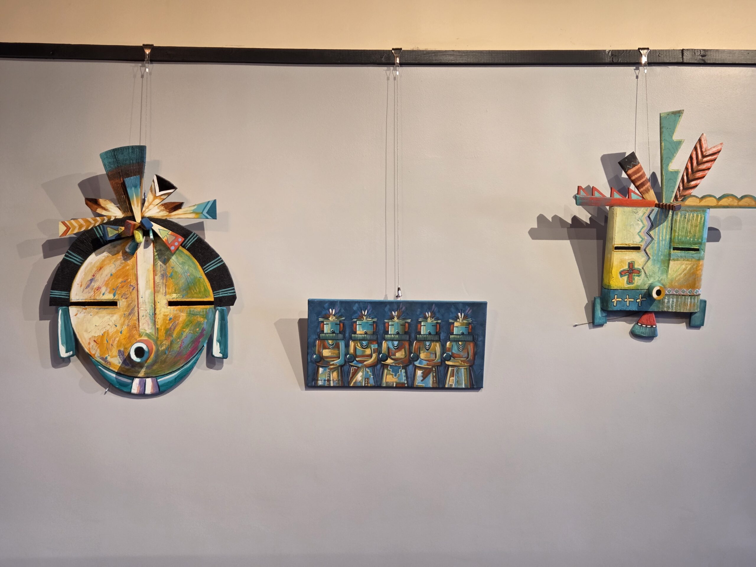 A wall of local art inside The Gandy Dancer Gallery